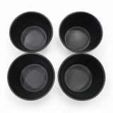 Set of four Japanese black ceramic tea cups with a satin-matte glaze