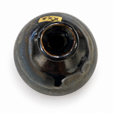 Top view of Kouzan ceramic bud vase showing its glossy rim and narrow one-inch opening