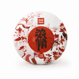 BESTLEAFTEA Ancient Tree Pu-erh tea cake with floral white and red wrapper on a clean white background