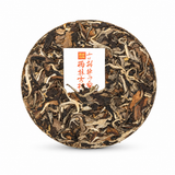 2021 Premium White Peony white tea cake showing silver buds and aged tea leaves