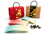 Pastel tea sampler pouches with BESTLEAFTEA red and kraft gift boxes on white background