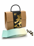 Elegant tea sampler collection featuring red gift box and artisan tea pouches