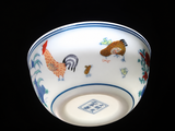 Underside of white ceramic gongfu tea cup with rooster artwork