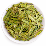 Dragon Well (Longjing) green tea leaves and a brewed cup, showing hot and cold brew setups.