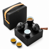Portable black tea set with travel case, teapot, pitcher, cup, and tea tray
