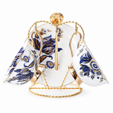 Blue and gold floral bone china cup and saucer set on gold display stand