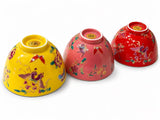 Colorful porcelain tea cup set in yellow red green blue and pink with butterfly floral design