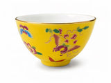 Yellow porcelain gongfu tea cup with butterfly and floral artwork