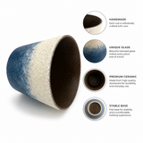 Handmade ceramic cup with ocean glaze shown tilted to highlight the rim, glaze, stoneware body, and stable base