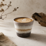 Mountain Mist stoneware mug with latte art on a rustic styled tabletop