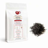 150g pouch of Best Leaf Tea Sun Moon Lake Ruby Black Tea beside loose dark tea leaves