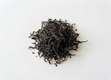 Loose, twisted dark leaves of Taiwan Sun Moon Lake Ruby Black Tea