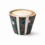 Hand-painted ceramic coffee cup with blue striped sides, raised rose relief, and glossy glaze