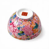 Underside of a floral gongfu tea cup with multicolor flower pattern