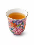 Wanhua floral tea aroma cup filled with tea, shown in front view