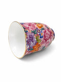 Wanhua floral tea aroma cup lying on its side, showing the floral pattern