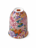 Wanhua floral tea aroma cup shown upside down, with floral design on the outside