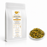 BESTLEAFTEA Osmanthus Long Jing green tea 250 g pouch with loose tea on a white plate