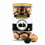 Organic black garlic cloves in jar ready to eat