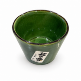 Angled view of the Japanese green ceramic noodle dipping cup showing the deep green interior and flared rim