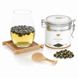 BestLeafTea Jasmine Pearl Green Tea tin with loose hand-rolled jasmine dragon pearls on white background