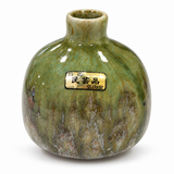 Handcrafted Kouzan Kiln Japanese ceramic vase with glossy green glaze and maker label, front view