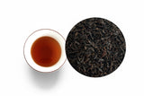 Taiwan lychee black tea set showing brewed tea and loose leaf texture, naturally smoked with lychee wood, premium quality tea